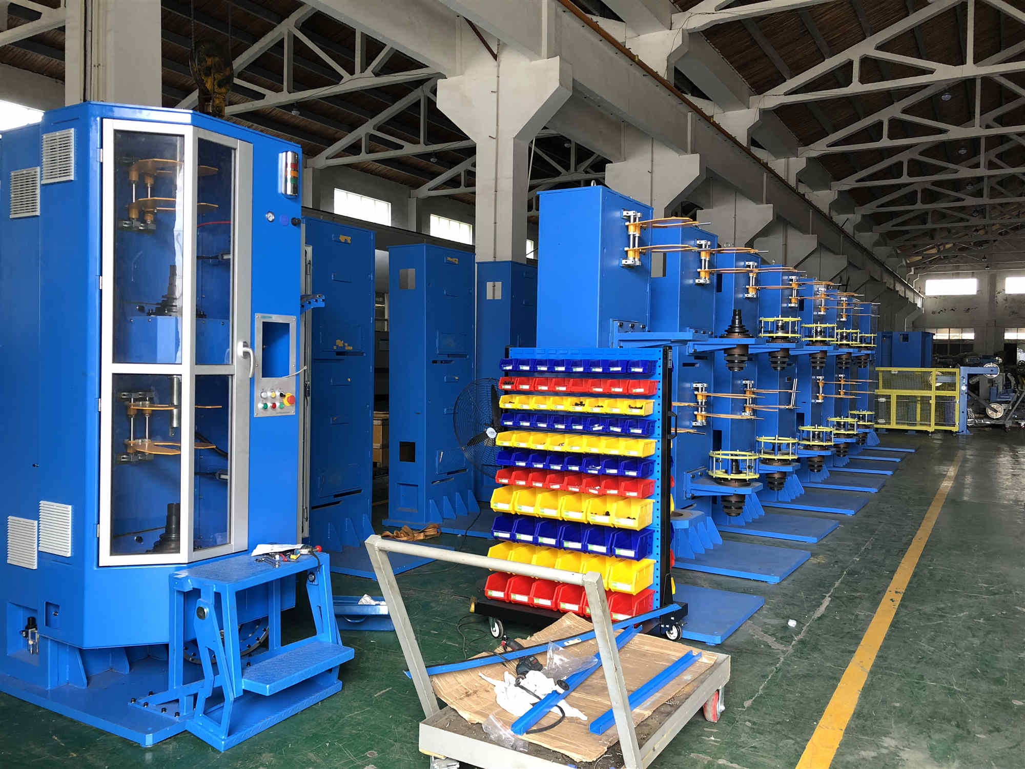 Vertical taping machines with pay off and take up
